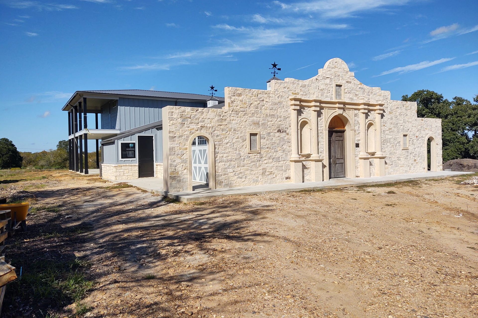 Three-quarter scale replica of the Alamo facade in cut limestone, built onto a barndominium near Fayetteville by Cross Creek